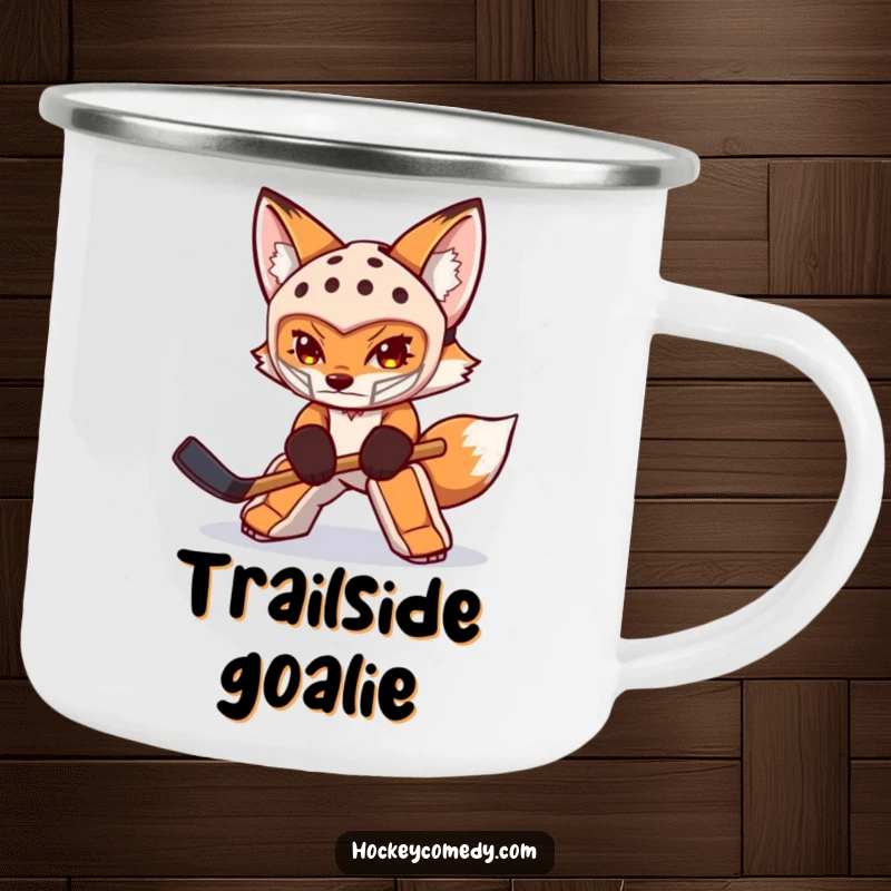 Funny fox enamel camping mug with a determined fox goalie in mask swatting a puck, ideal for outdoor enjoyment and sports themes.