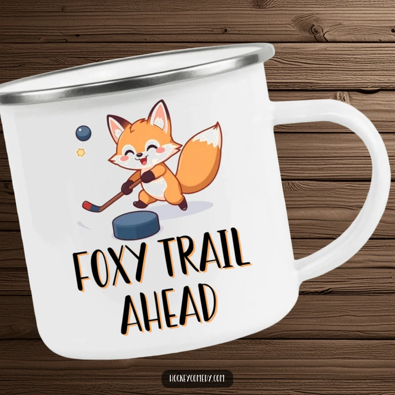 Funny camping mug with a cheerful fox attempting a slap shot, puck slightly off target, ideal for enjoying beverages outdoors with humor.