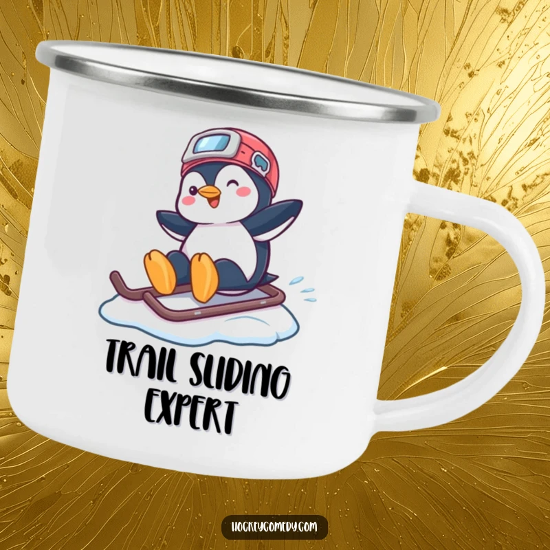 Funny camping mug with a playful penguin sliding across ice on a hockey helmet, ideal for outdoor adventures.