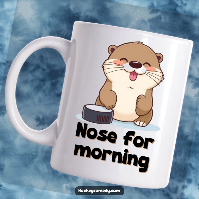 Funny cheerful otter trying to catch a hockey puck with its nose on this humorous mug.