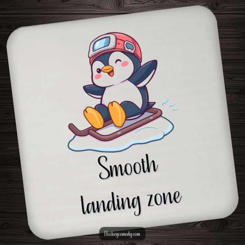 Funny coaster featuring a playful penguin sliding across ice on a hockey helmet, adding humor to drink service.