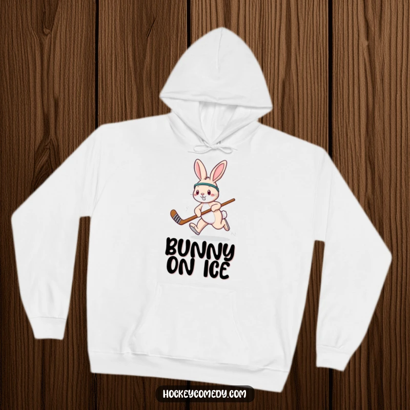 Funny playful rabbit hockey hoodie, showing a rabbit hopping energetically with a hockey stick, ready to play.
