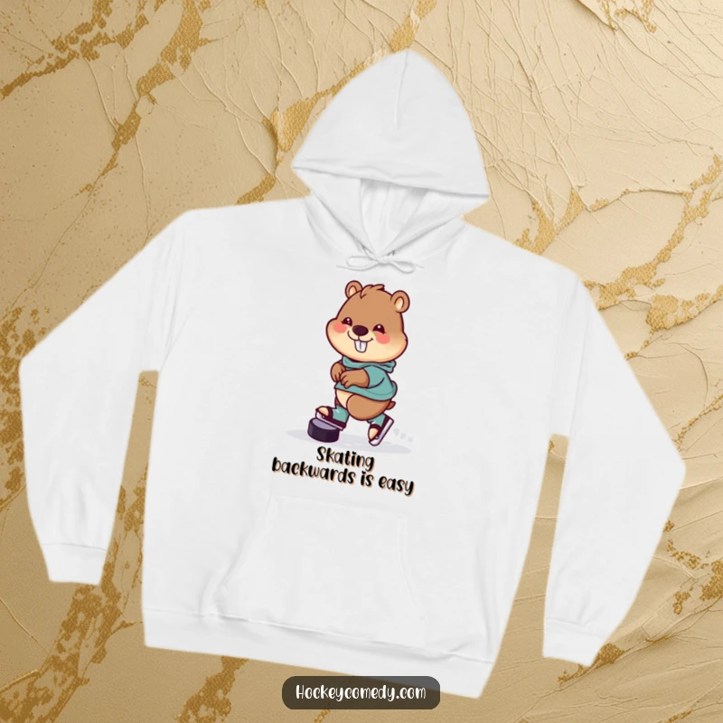 Funny Hoodie with a cheerful beaver skating backwards with a hockey puck, perfect for staying warm and conveying playful humor.