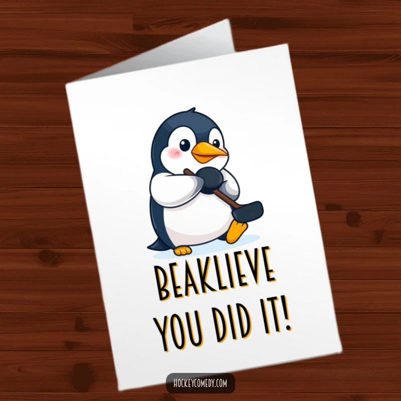 Funny Free Printable penguin focused on batting a hockey puck with its beak, perfect for a congratulations card.