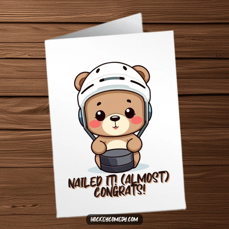 Funny Free Printable Congratulations Card: A small bear in a hockey helmet comically misses a puck, celebrating a win with humor.