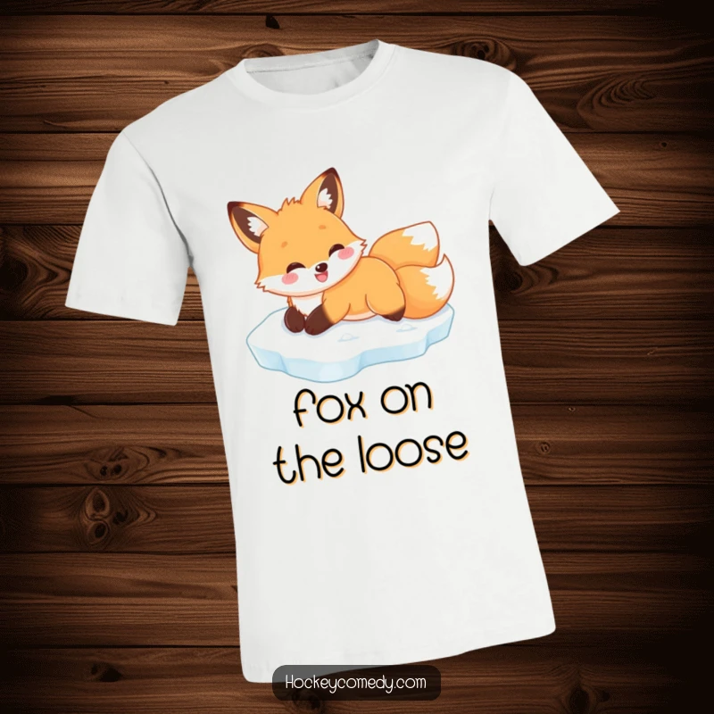 Funny smiling fox t-shirt, captured mid-belly slide on ice, radiating happiness and winter fun humorously.