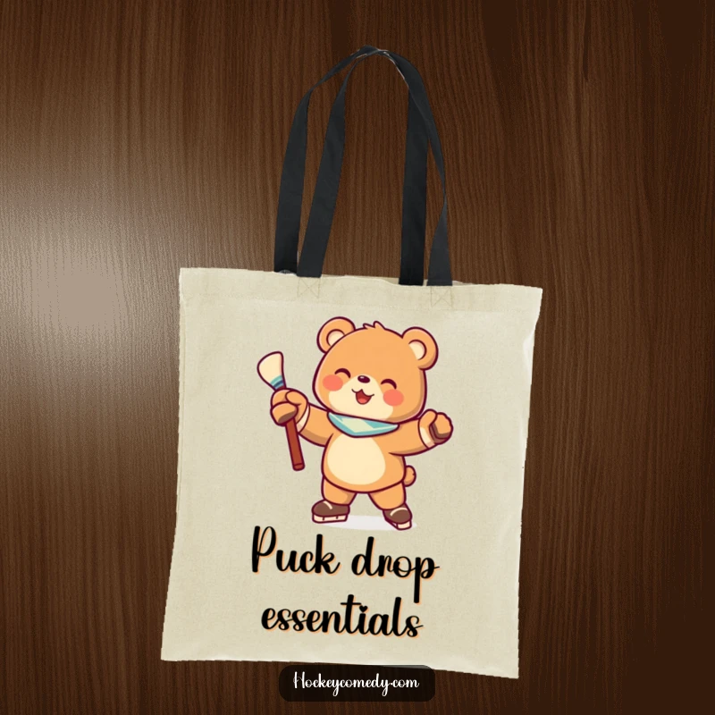 Funny tote bag featuring a joyful bear character in a hockey stance with a stick, perfect for carrying groceries and funny vibes.