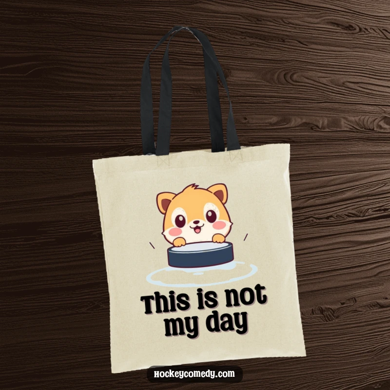 Funny tote bag with a shocked animal frozen in fear of an approaching hockey puck, ideal for carrying essentials humorously.