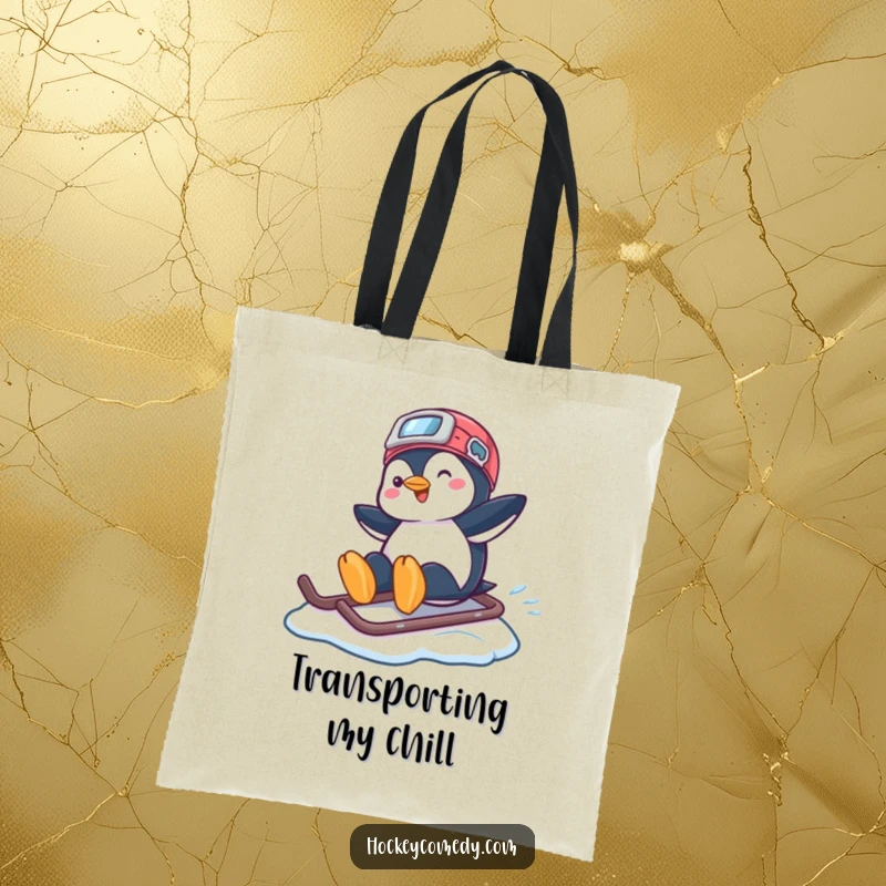 Funny tote bag with a playful penguin happily sliding on a hockey helmet across a frozen surface.